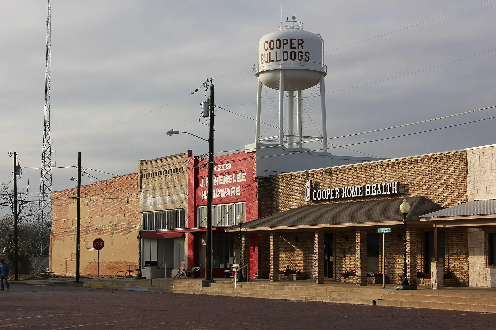 Downtown Cooper, Texas, with the Cooper Bulldogs water tower above the storefronts