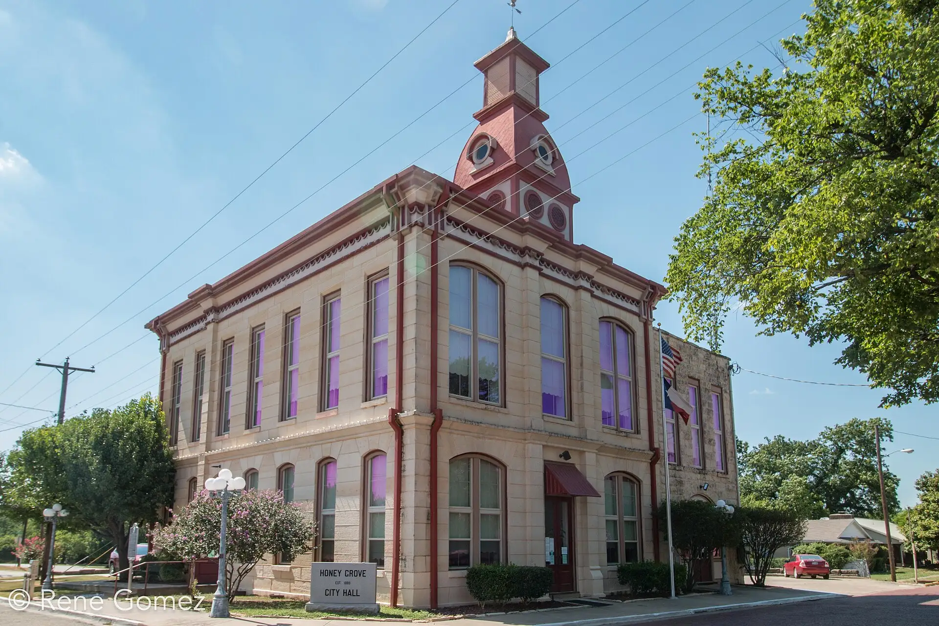 Honey Grove City Hall, a two-story brick building with a cupola